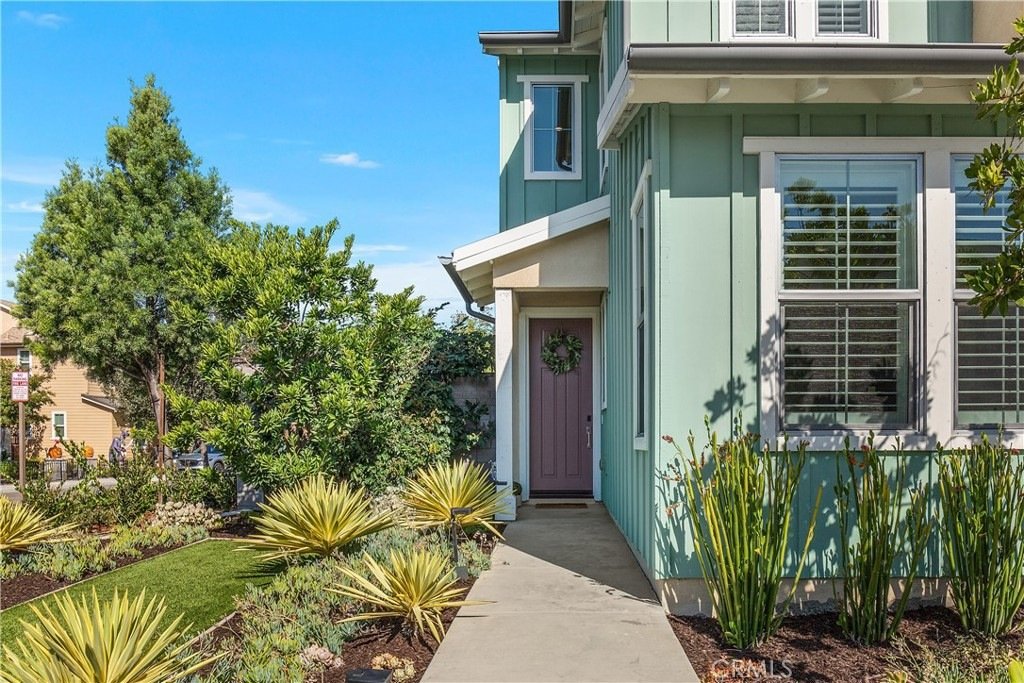 Two-story residence on Veraz Rd, Rancho Mission Viejo, CA, featuring modern architecture, a tiled roof, and drought-tolerant landscaping.
