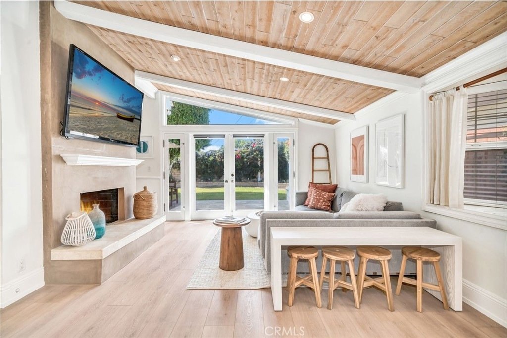 Front of a house on Hanover Dr, Costa Mesa, CA, with a garage and green grass.