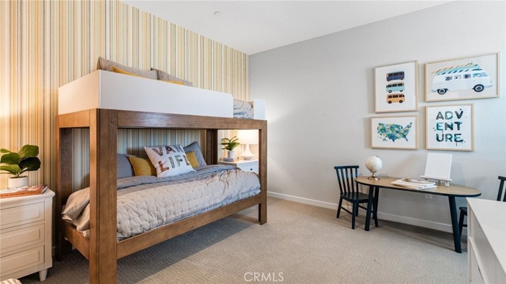 Children's room on Montoya Paseo, Ontario, CA, with a wooden bunk bed, striped wallpaper, an adventure theme, and a small desk with a globe.
